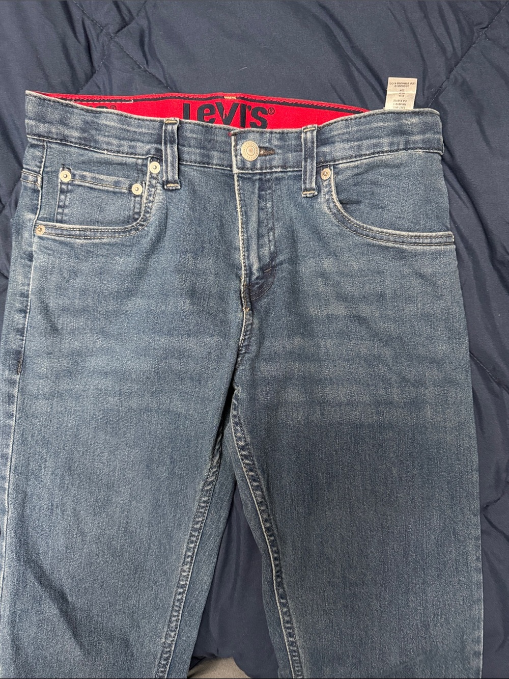 Levi's Light Blue Straight Jeans with Subtle Red Waistband Detail